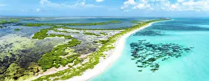 Leeward Islands Prints: Aerial view of idyllic tropical shore overlooking the crystal Caribbean Sea and lagoon