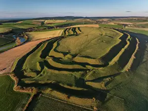 Aerial view of Iron Age Hillfort Maiden Castle near Dorchester, Dorset, England. Winter (January) 2024