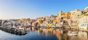 Campania Prints: Aerial view of La Corricella fishing village and old harbor at sunset