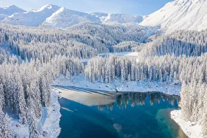 Winterscape Prints: The aerial view of Lake Obernberg after a heavy snowfall