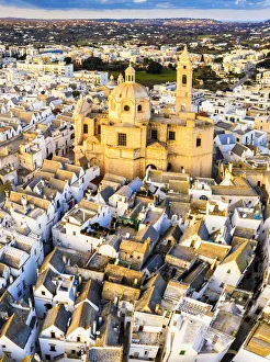 Itria Valley Prints: Aerial view of Locorotondo church at sunset. Locorotondo, Apulia, Italy