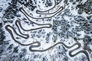 Mountain Pass Prints: Aerial view of the Maloja Pass covered in snow