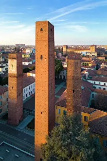 City Centre Prints: Aerial view of the medieval towers of Pavia and Visconti Castle at sunset