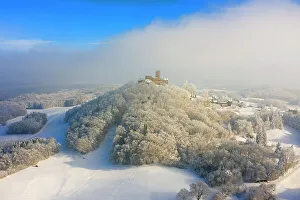 Aerial view at Nuerburg castle in winter, Nuerburg, Eifel, Rhineland-Palatinate, Germany