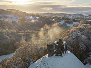 Mavic Prints: Aerial view of Okehampton Castle in the snow, Devon, England. Autumn (November) 2024