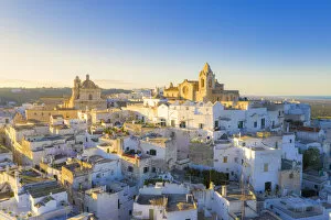 Blue Sky Gallery: Aerial view of the old town of Ostuni at sunset, Apulia, Italy