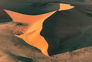 Sossusvlei Prints: Aerial view of orange sand dunes from helicopter