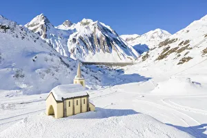 Ski Slopes Prints: Aerial view of the Oratorio di Sant Anna church, Riale and the Morasco lake