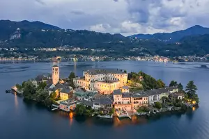Aerial view of Orta San Giulio and Lake Orta at blu hour before a storm. Orta Lake