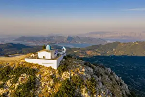 Lefkada Prints: Aerial view of the Orthodox church of the Prophet Elias at sunset in summer