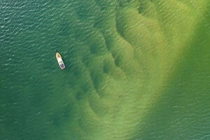Aerial view of Padstow speedboat Fireball moored in the Camel Estuary, Padstow, Cornwall, England. Spring (April) 2022