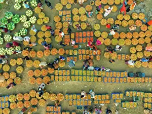 Retail Prints: Aerial view of people trading with fruits and vegetables on boats along the river in Brahmanbaria