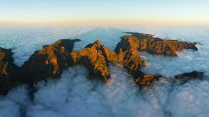 Above The Clouds Prints: aerial view of Pico do Arieriro during a warm spring sunset, Madeira, Portugal