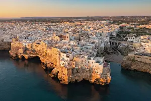 Adriatic Sea Prints: Aerial view of Polignano a mare at sunrise. Bari province, Apulia, Italy