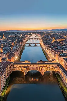Toscana Prints: Aerial view of Ponte Vecchio and Arno river at dusk. Florence, Tuscany, Italy