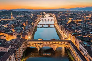 Toscana Prints: Aerial view of Ponte Vecchio and Arno river at dusk. Florence, Tuscany, Italy