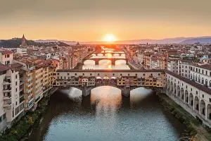 Toscana Prints: Aerial view of Ponte Vecchio and Arno river at sunset. Florence, Tuscany, Italy