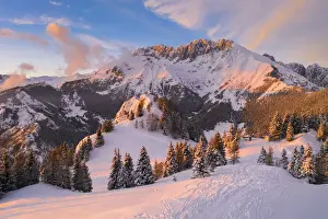 Mount Prints: Aerial view of the Presolana covered in snow at sunset from Mount Scanapà