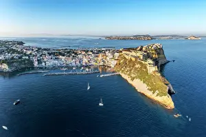 Campania Prints: Aerial view of Procida island skyline and headland at sunset