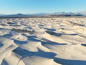 Cordillera Prints: Aerial view of the Pumice Stone Field at sunset with the Carachi Pampa volcano in background