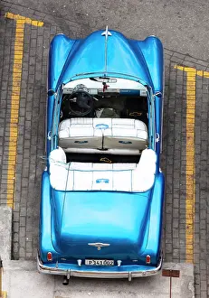 Classic Prints: Aerial view of restored classic American car used to take tourists on city tours