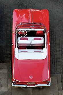 Convertible Prints: Aerial view of restored classic American car used to take tourists on city tours