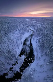 Loneliness Prints: Aerial view of a river during a winter evening in the Yllas-Pallastunturi National Park