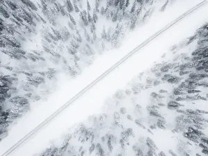 Kittila Prints: Aerial view of road in the snow covered forest, Pallas-Yllastunturi National Park