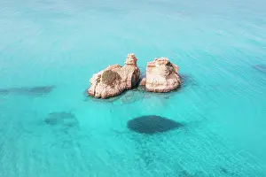 Adriatic Sea Prints: Aerial view of two rock formations in crystal-clear turquoise waters