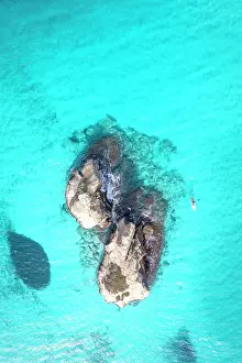 Adriatic Sea Prints: Aerial view of two rock formations in crystal-clear turquoise waters