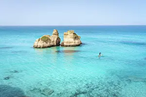 Adriatic Sea Prints: Aerial view of two rock formations in crystal-clear turquoise waters