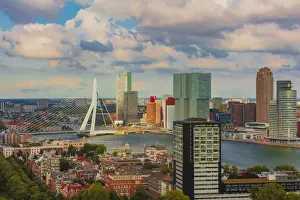 Seaport Prints: Aerial view of Rotterdam skyline with Erasmus bridge and skyscrapers