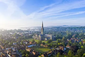 Aerial view over Salisbury and Salisbury Cathedral on a misty summer morning, Salisbury