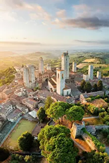 Toscana Prints: Aerial view of San Gimignano with its characteristic towers at sunrise