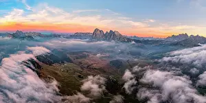 Siusi Prints: Aerial view of Sassolungo and Sassopiatto on a misty autumn sunrise