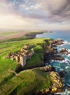 North Sea Prints: Aerial view of Slains Castle at sunset