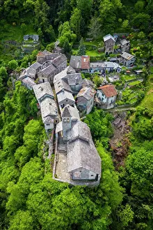 Romanesque Prints: Aerial view of the small village of Carmine Superiore on Lake Maggiore in the spring