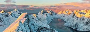 Lofoten Prints: Aerial view of snowy peaks and frozen fjord at sunset, Reine, Lofoten Islands, Norway