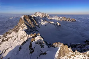 Valle Daosta Prints: Aerial view of snowy peaks of Mont Blanc during sunrise, Courmayeur, Aosta Valley, Italy