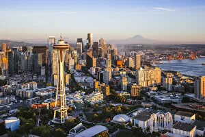Images Dated 11th September 2017: Aerial view of The Space Needle and downtown skyline at sunset with Mt Rainier in the background