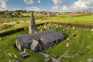 Aerial view of St Enodoc Church in the village of Trebetherick, Cornwall, England. Spring (April) 2022