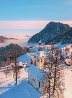 Images Dated 24th February 2023: Aerial view of St Thomas Church and the Kamnik Alps, Rantovse, Slovenia at sunset