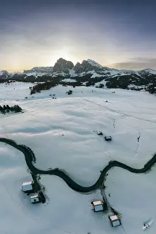 Sassopiatto Prints: Aerial view at sunrise of the Alpe di Siusi (Seiser Alm) on a clear winter morning