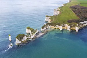 Aerial view at sunrise of the Old Harry Rocks, chalky formations near Handfast Point