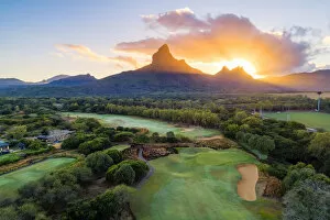 Aerial view of Tamarina golf course with Rempart mountain and Trois mamelles mountain