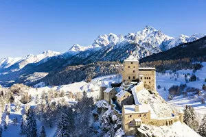Aerial view of Tarasp castle after snowfall. Tarasp, Lower Engadine, Canton of Grisons