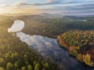 Aerial view of Tottiford Reservoir at dawn on a misty Winter morning, Dartmoor National Park, Devon, England. Winter (February) 2025