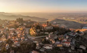 Wine Region Prints: Aerial view of the town of Cigognola and its castle