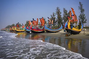 Aerial view of traditional fishing boats along the shoreline on the beach on Teknaf Aerial view of traditional fishing boats along the shoreline on the beach on Teknaf