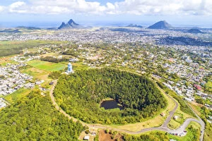 Aerial view of Trou Aux cerfs volcano crater with Curepipe city, Rempart mountain